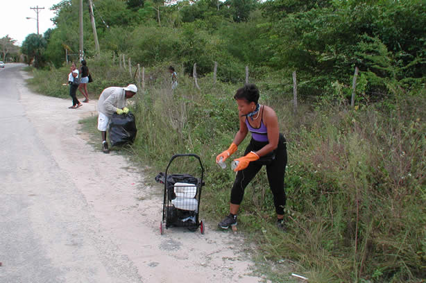 Volunteers Clean-Up Roadside Entrance to Negril - Negril Travel Guide