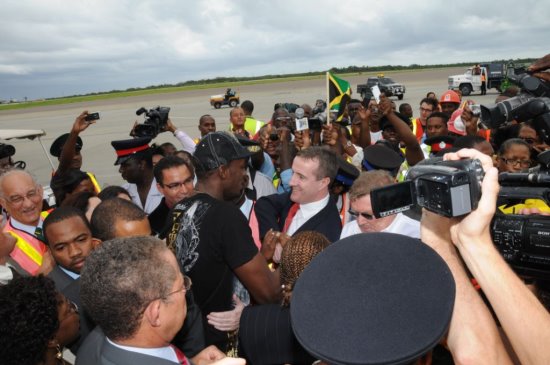 Digicel Jamaica CEO, Mark Linehan, greets the Fastest Man in the World, Usain Bolt -  Negril Travel Guide - Negril, Jamaica WI - NegrilTravelGuide.com - http://www.negriltravelguide.com - info@negriltravelguide.com