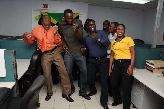 Usain Bolt and Digicel employees dance to Elephant Man's Nuh Linga - Negril Travel Guide - Negril, Jamaica WI - NegrilTravelGuide.com - http://www.negriltravelguide.com - info@negriltravelguide.com